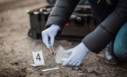 Crime scene cleanup crew removing biohazard waste in Dallas County