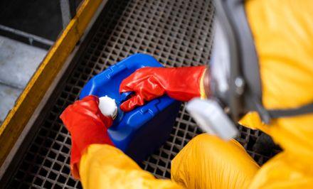 Meth testing technician collecting a residue sample in Plano