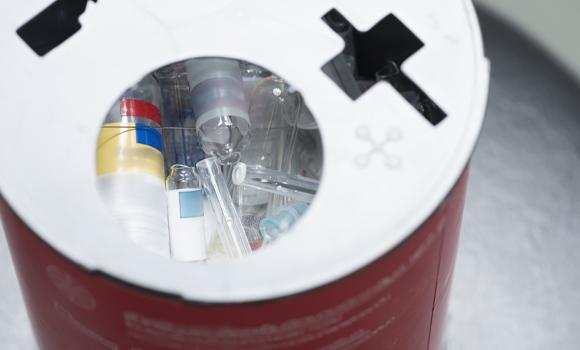 Medical waste pickup containers staged for removal in Plano